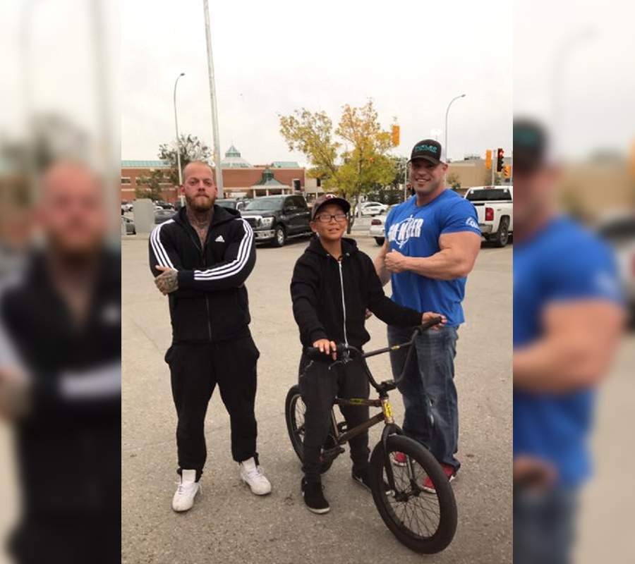 Krystle's two bodybuilder friends and her son after they got his bike back.