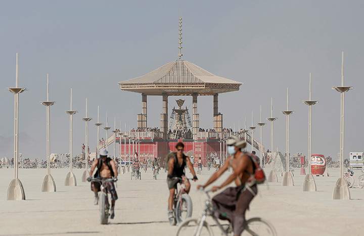 Participants explore the playa at the Burning Man arts and music festival in the Black Rock Desert of Nevada, August 28, 2017.