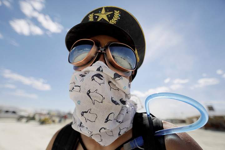 A Burning Man participant explores Black Rock City on her bicycle during the 1st full day of the annual Burning Man arts and music festival in the Black Rock Desert of Nevada, August 28, 2017.