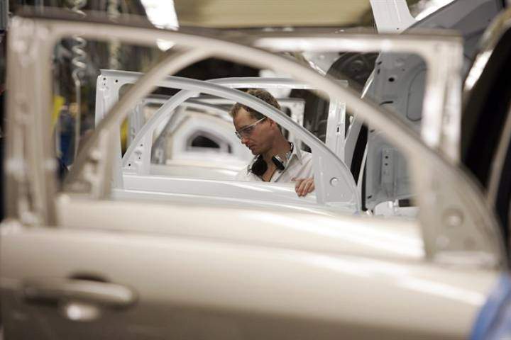 Doors and window openings line up on the Trim line, where window regulators, trim panels and window glass is installed at the CAMI Automotive facility in Ingersoll, Ontario, Thursday, Dec. 21, 2006.