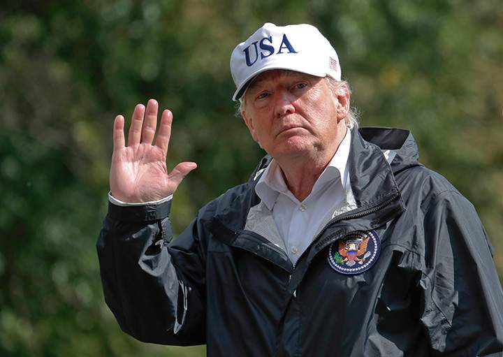 President Donald Trump waves as he arrives at the White House, Thursday, Sept. 14, 2017, in Washington. 