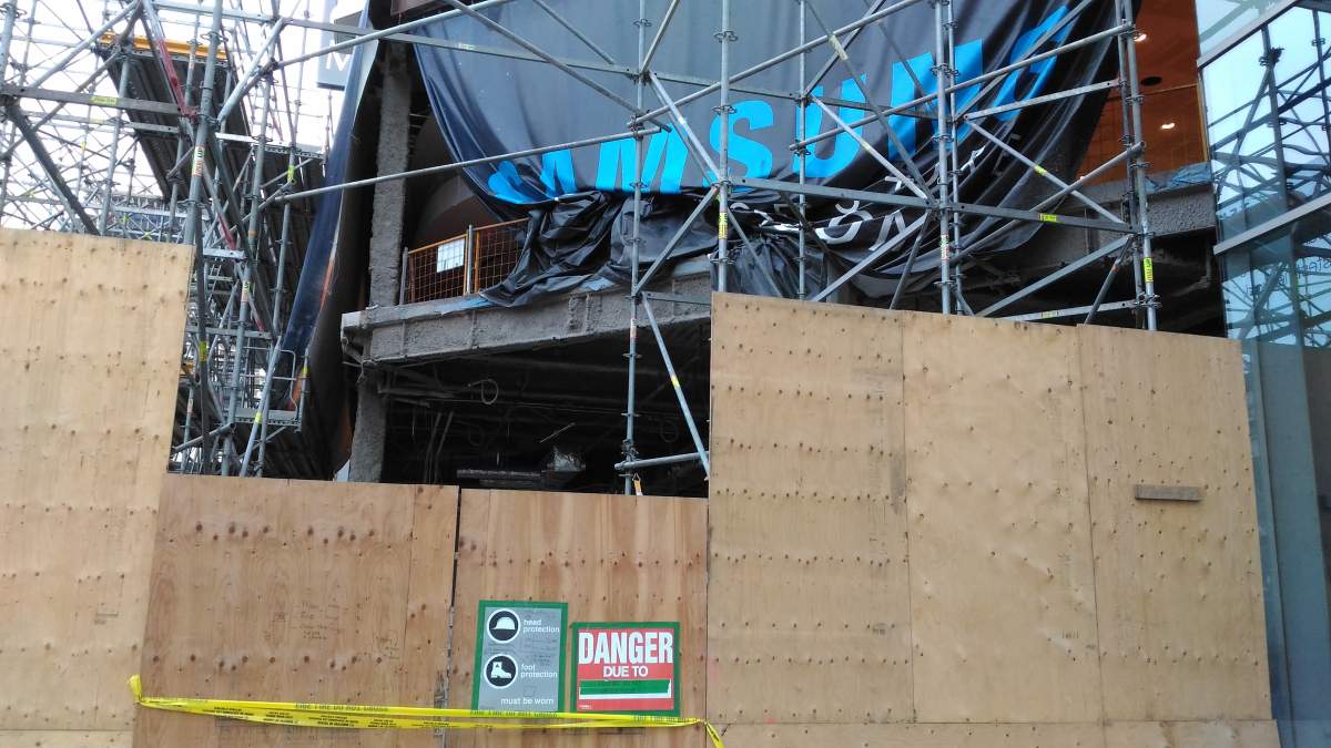 A man is dead after falling from a construction site at Eaton Centre.