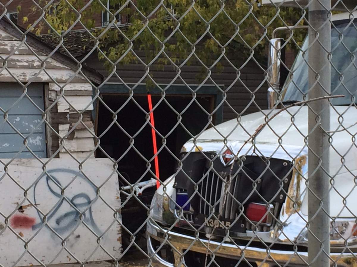 Edmonton Police Service homicide detectives are investigating after a man’s body was dug up from under a garage near 118 Avenue and 96 Street in north Edmonton. September 30, 2017.