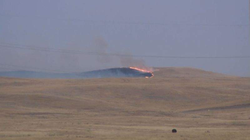 A fire burns in southeastern Alberta south of Oyen near the Saskatchewan border on Tuesday, Sept. 12, 2017.