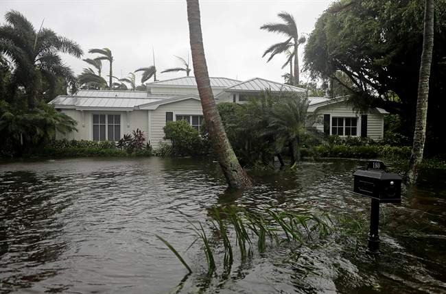 A houses is surrounded by water as Hurricane Irma passes through Naples, Fla., Sunday, Sept. 10, 2017.