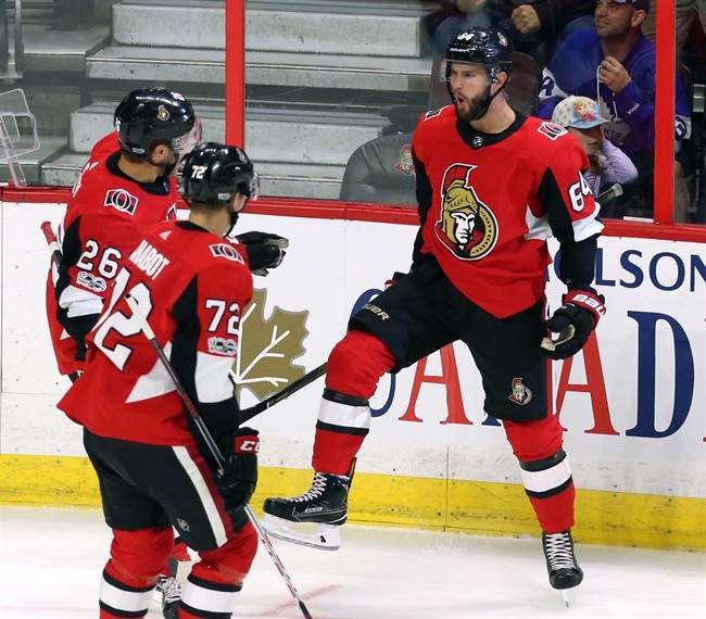 Ottawa Senators forward Tyler Randell (64) celebrates his goal against the Toronto Maple Leafs with forward Ben Sexton (26) and defenceman Thomas Chabot (72) during first period NHL preseason hockey in Ottawa on Monday, September 18, 2017. 