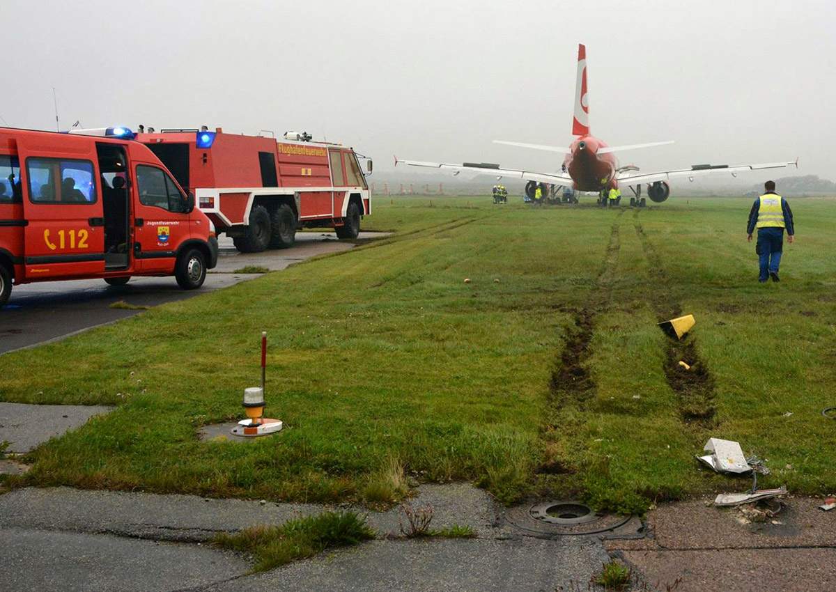 In this picture released by the fire brigade Westerland ( Freiwillige Feuerwehr Westerland), an Airbus of Air Berlin stands in a meadow near Westerland on the German North Sea island of Sylt, Saturday, Sept. 30, 2017. 