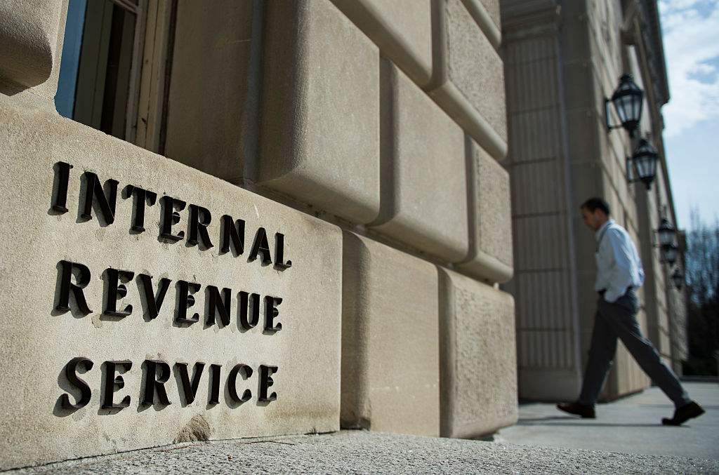 A man walks into the Internal Revenue Service building in Washington, DC on March 10, 2016. 