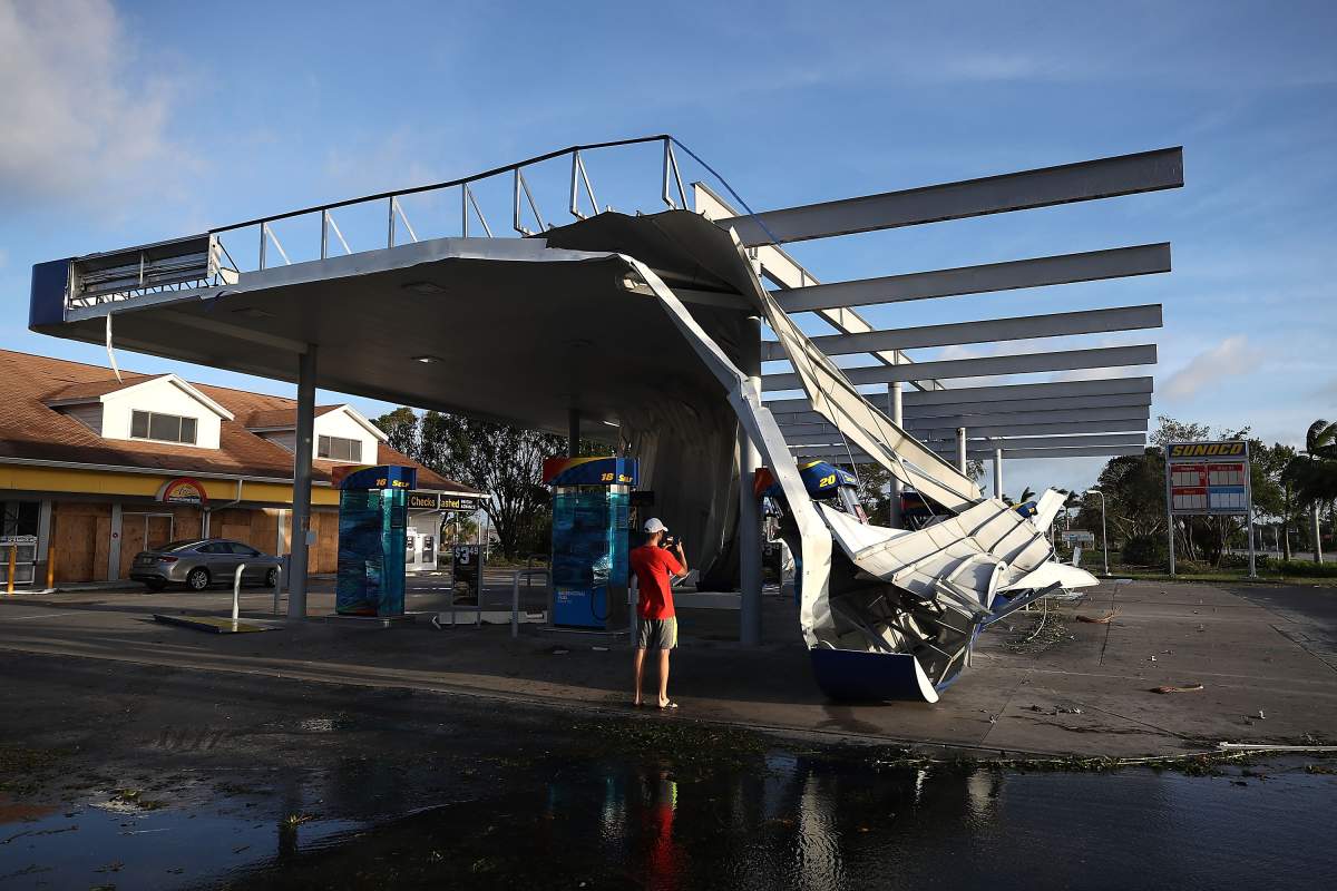 The roof of a gas station is shown damaged by Hurricane Irma winds on September 11, 2017 in Bonita Springs, Florida.