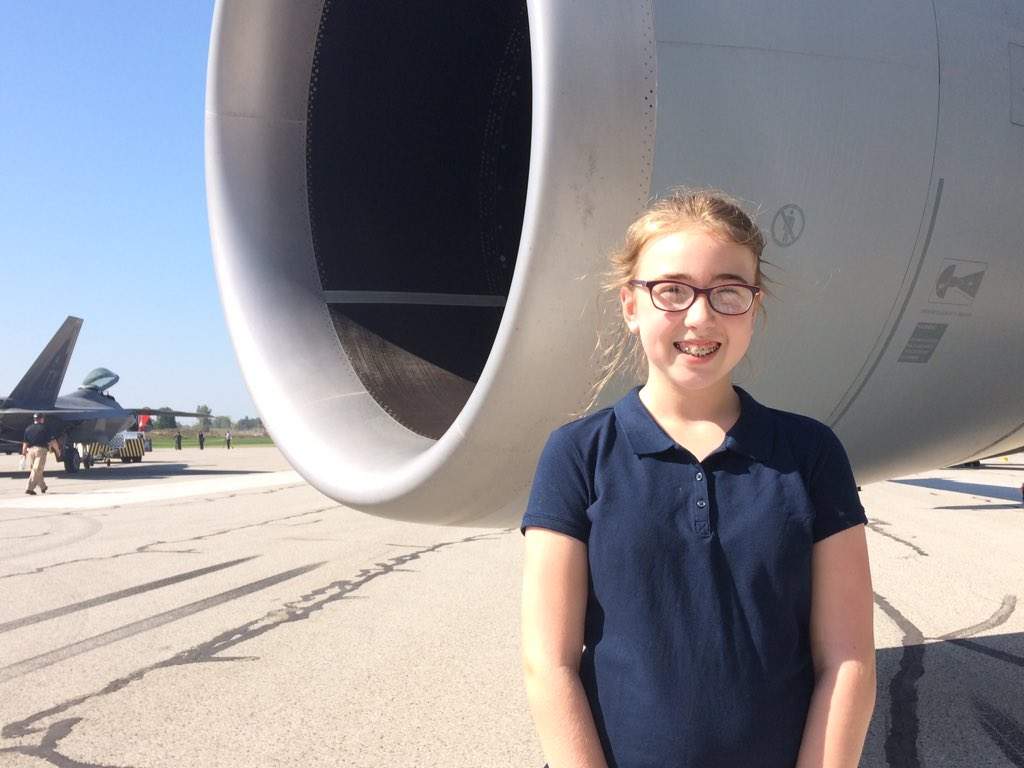 Eleven-year-old Hannah Freyer stands next to the Airbus KC-30A.