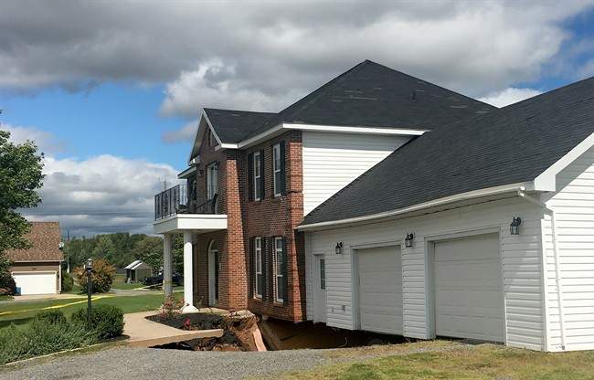 Municipal authorities in Falmouth, about 70 kilometres from Halifax, said a family of four will not be able to retrieve their remaining possessions before the two-storey house is demolished, taking 10 years of memories with it. 