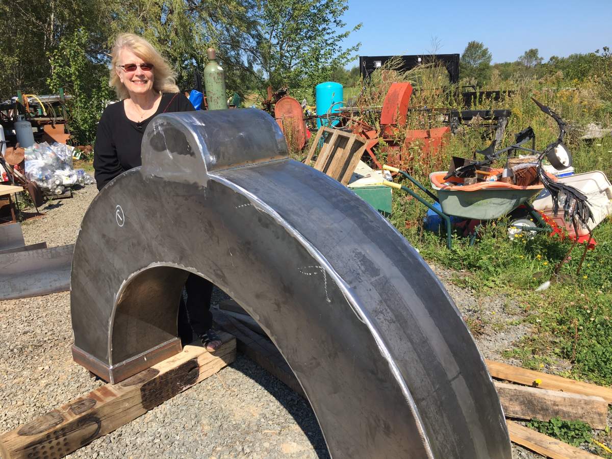 Nancy Keating poses with a portion of the Canada Gate, a structure she designed