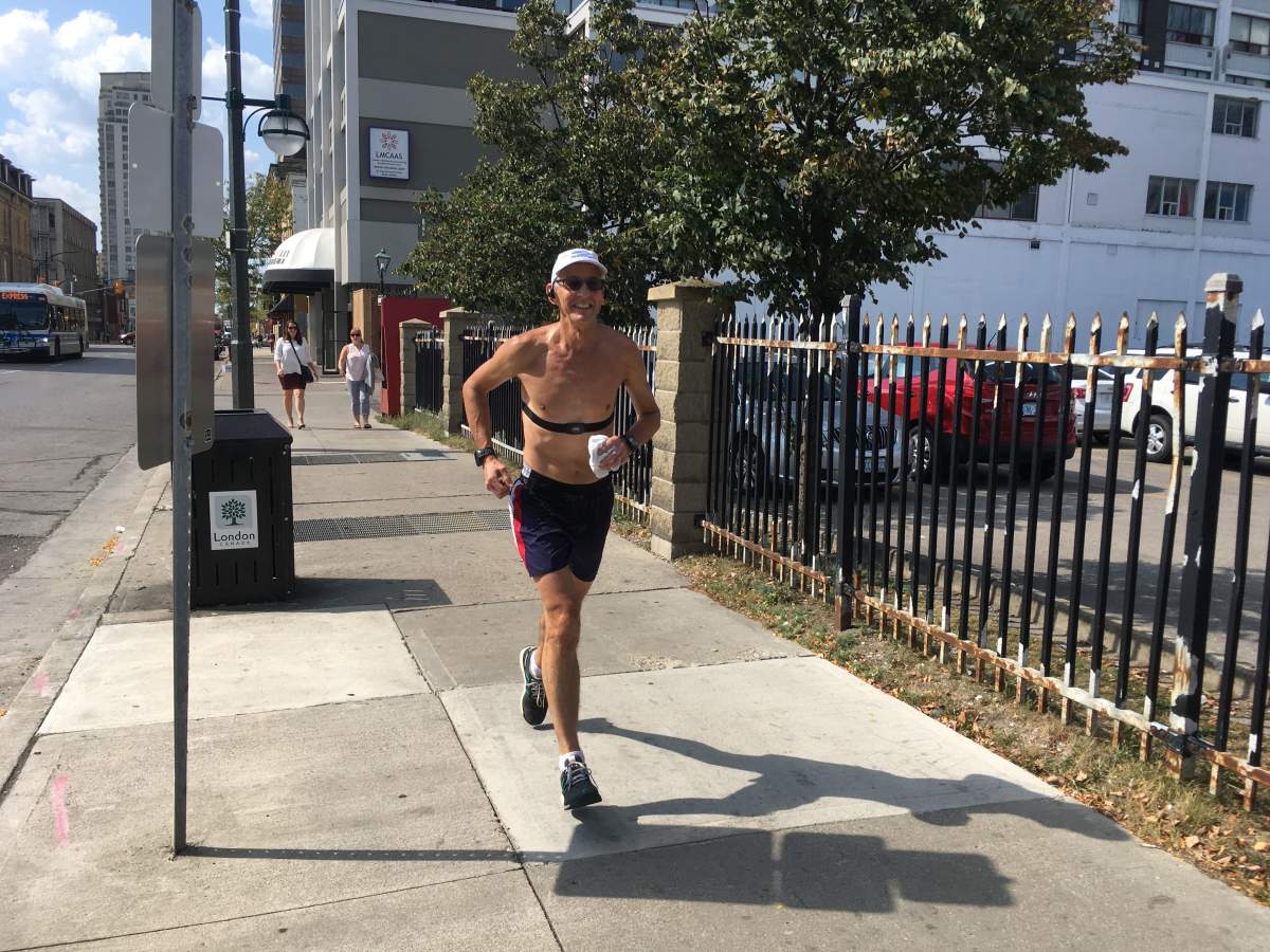 A London man out for a jog in the midday sun on September 26, 2017.