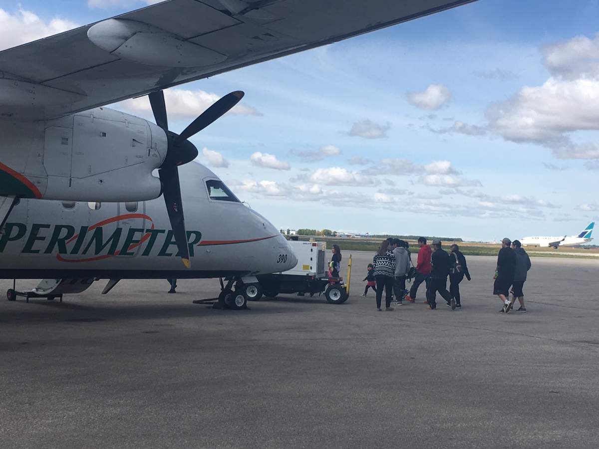 Residents of Poplar River First Nation return home Tuesday.