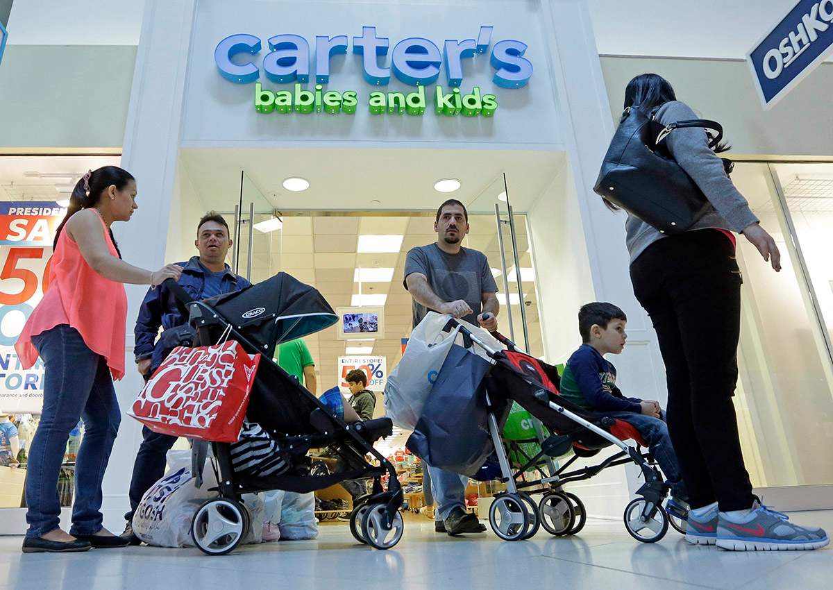 In this Tuesday, Feb. 9, 2016, file photo, people shop in Miami. After years of sluggish growth, typical U.S. household incomes finally topped pre-recession levels in 2016 and reached an all-time high, according to information released by the Census Bureau, Tuesday, Sept. 12, 2017.