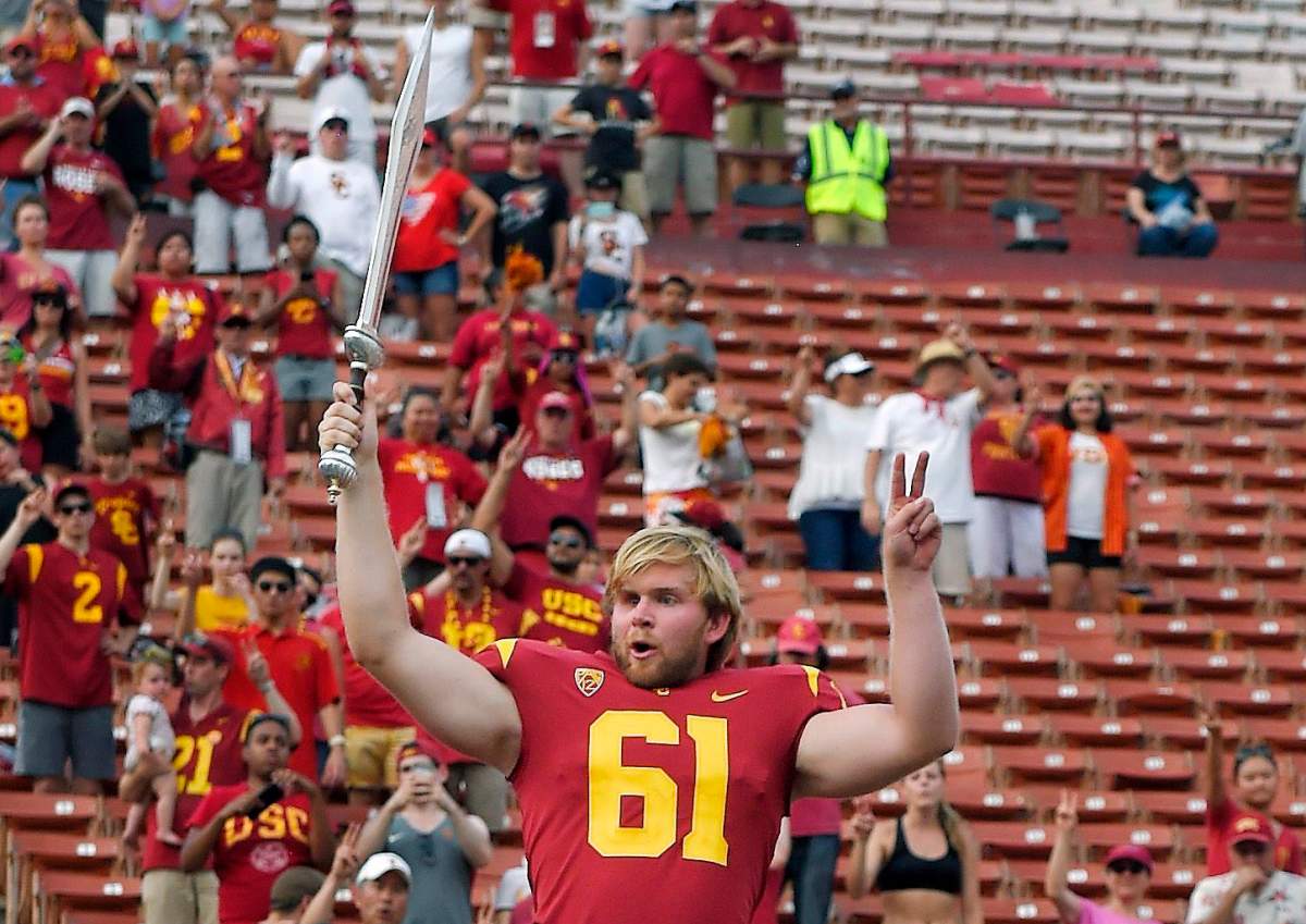 Southern California long snapper Jake Olson leads the USC Trojan Marching Band following an NCAA college football game against Western Michigan, Saturday, Sept. 2, 2017, in Los Angeles.