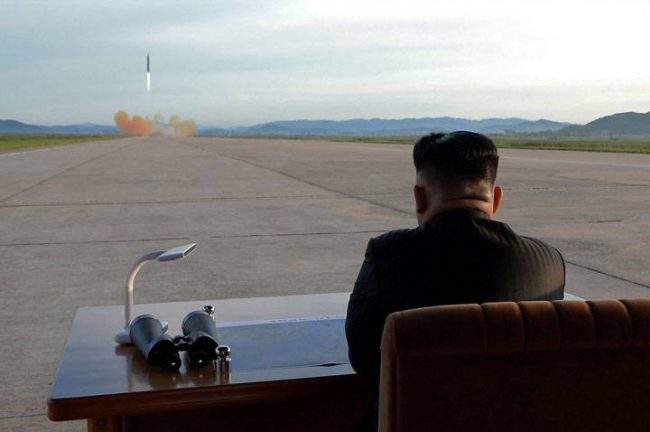 Kim Jong Un watches a missile launch