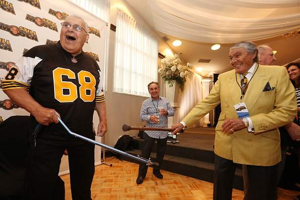Fundraiser In Honour Of Angelo Mosca, ON- AUGUST 26 – Charles Juravinski jokes with Angelo Mosca at a Fundraiser in honour of Angelo Mosca, Ti-Cat great who has been diagnosed with Alzhiemers at the Carmen’s Banquet Centre in Hamilton. August 26, 2015. Steve Russell/Toronto Star (Steve Russell/Toronto Star via Getty Images)