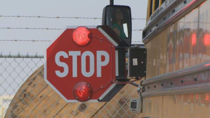Guelph police say two drivers have been charged with passing a stopped school bus as students returned to in-person learning.