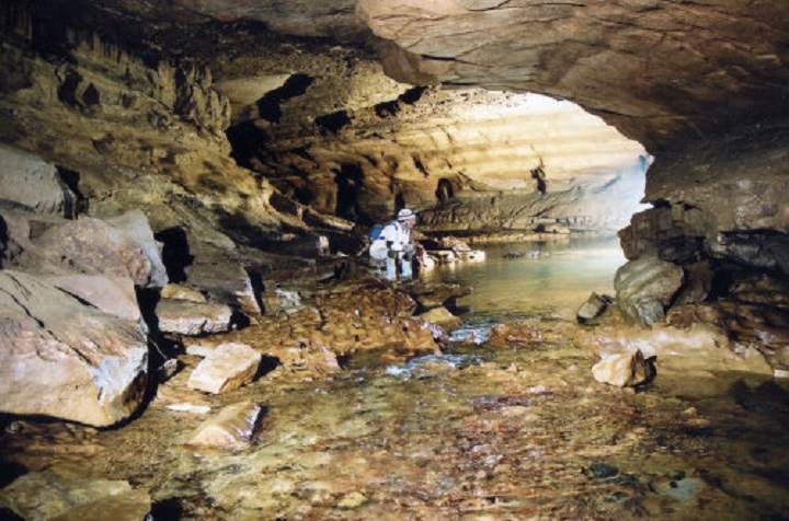 File photo shows a spelunker exploreing Sullivan Cave near Bloomington, Ind., where the university student was locked inside for 60 hours.
