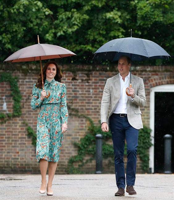 In this Wednesday, Aug. 30, 2017 file photo Britain’s Prince William and his wife Kate, Duchess of Cambridge smile as they arrive at the memorial garden in Kensington Palace, London.