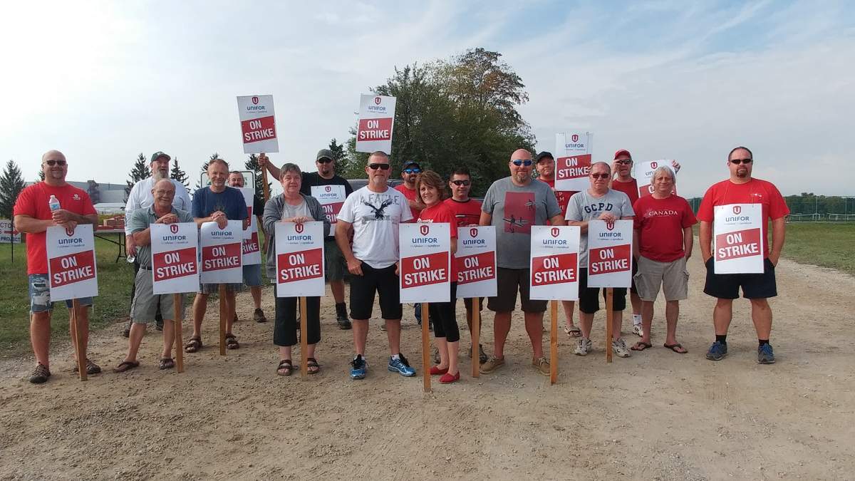 Members of Unifor local 88 hit the picket line outside the GM assembly plant in Ingersoll, Ont.