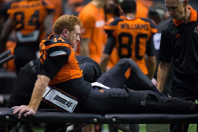 B.C. Lions’ quarterback Travis Lulay sits on the sideline after leaving the game with an injury during the first half of a CFL football game against the Montreal Alouettes in Vancouver, B.C., on Friday September 8, 2017.