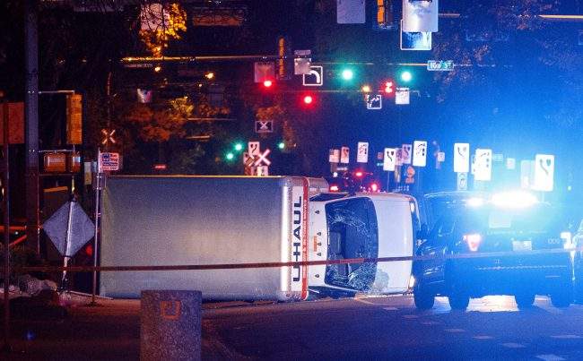 Police investigate after a U-Haul van ran into pedestrians in Edmonton, Alta., Sept. 30, 2017.