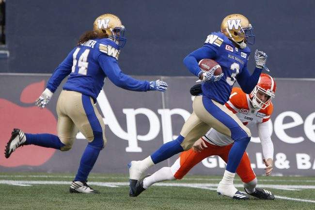 B.C. Lions kicker Ty Long (1) can't stop Winnipeg Blue Bombers defensive back Kevin Fogg (3) as he returns his kick for the touchdown during the first half of CFL action in Winnipeg on Saturday, October 14, 2017. 