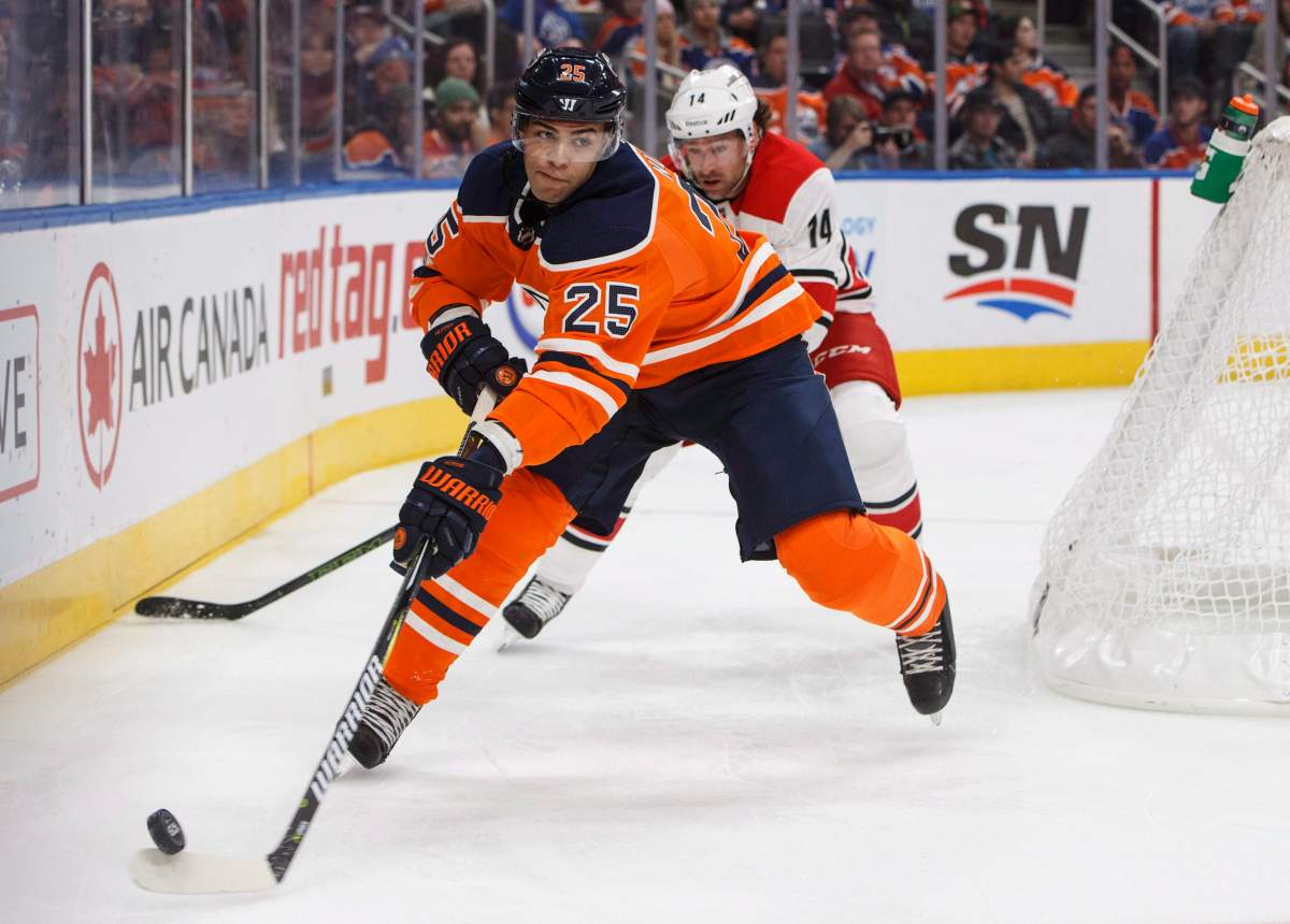 Carolina Hurricanes' Justin Williams (14) chases Edmonton Oilers' Darnell Nurse (25) during first period NHL action in Edmonton, Alta., on Tuesday, October 17, 2017. 