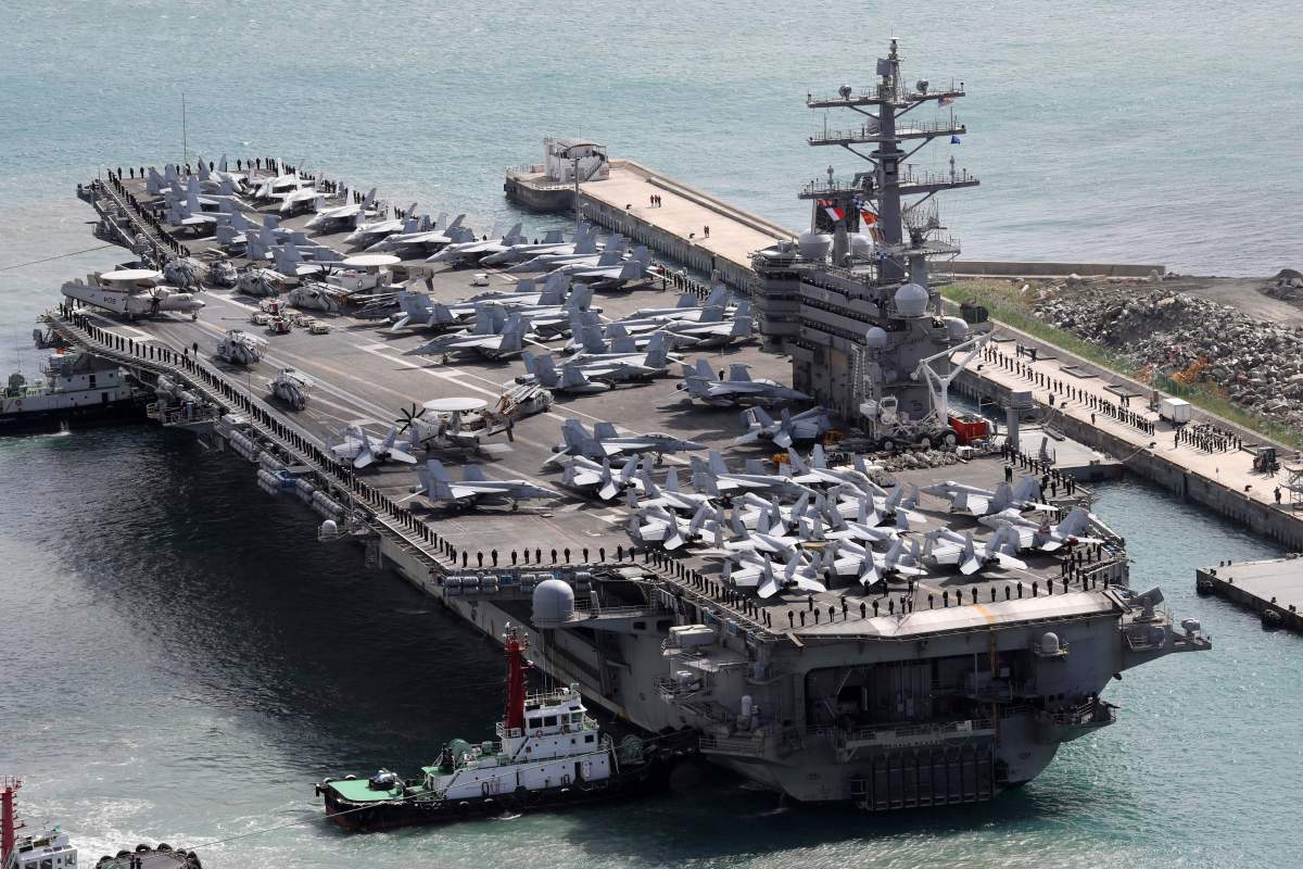 U.S. naval commanders on Saturday reiterated Washington's "ironclad" commitment to defend South Korea against North Korean threats as the American nuclear-powered aircraft carrier visited a South Korean port following a joint naval drill.