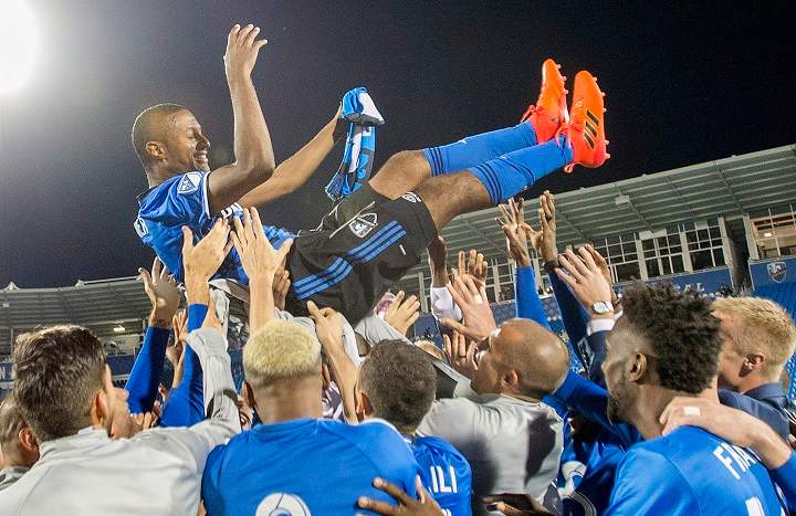 Montreal Impact’s Patrcie Bernier is lifted up by teammates following his final MLS soccer game, against the New England Revolution in Montreal, Sunday, October 22, 2017. THE CANADIAN PRESS/