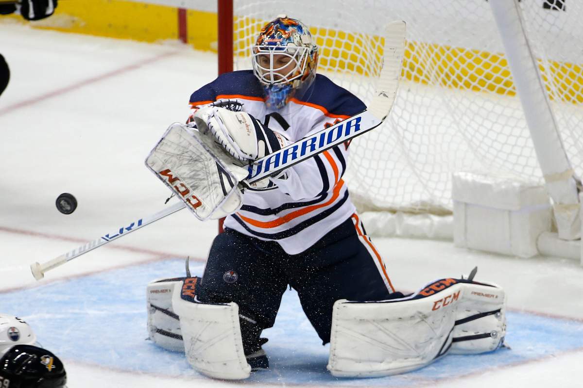 Edmonton Oilers goalie Cam Talbot blocks a shot in the third period of an NHL hockey game against the Pittsburgh Penguins in Pittsburgh, Tuesday, Oct. 24, 2017. The Penguins won 2-1 in overtime. (AP Photo/Gene J. Puskar).