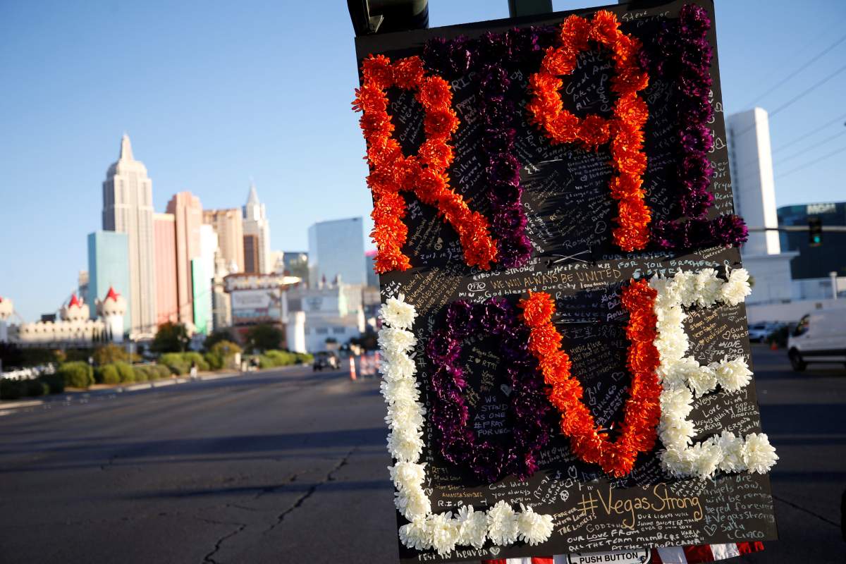 Messages are pictured on a sign at a makeshift memorial in the middle of Las Vegas Boulevard following the mass shooting in Las Vegas, Nevada, U.S., October 5, 2017.