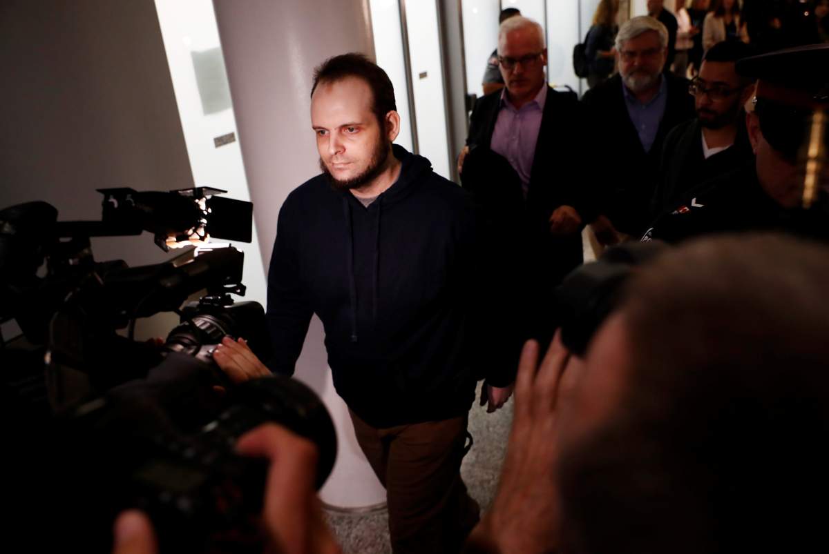 Joshua Boyle walks through the airport after arriving with his wife and three children at Toronto Pearson International Airport, nearly 5 years after he and his wife were abducted in Afghanistan in 2012 by the Taliban-allied Haqqani network, in Toronto, Ontario, Canada, October 13, 2017.
