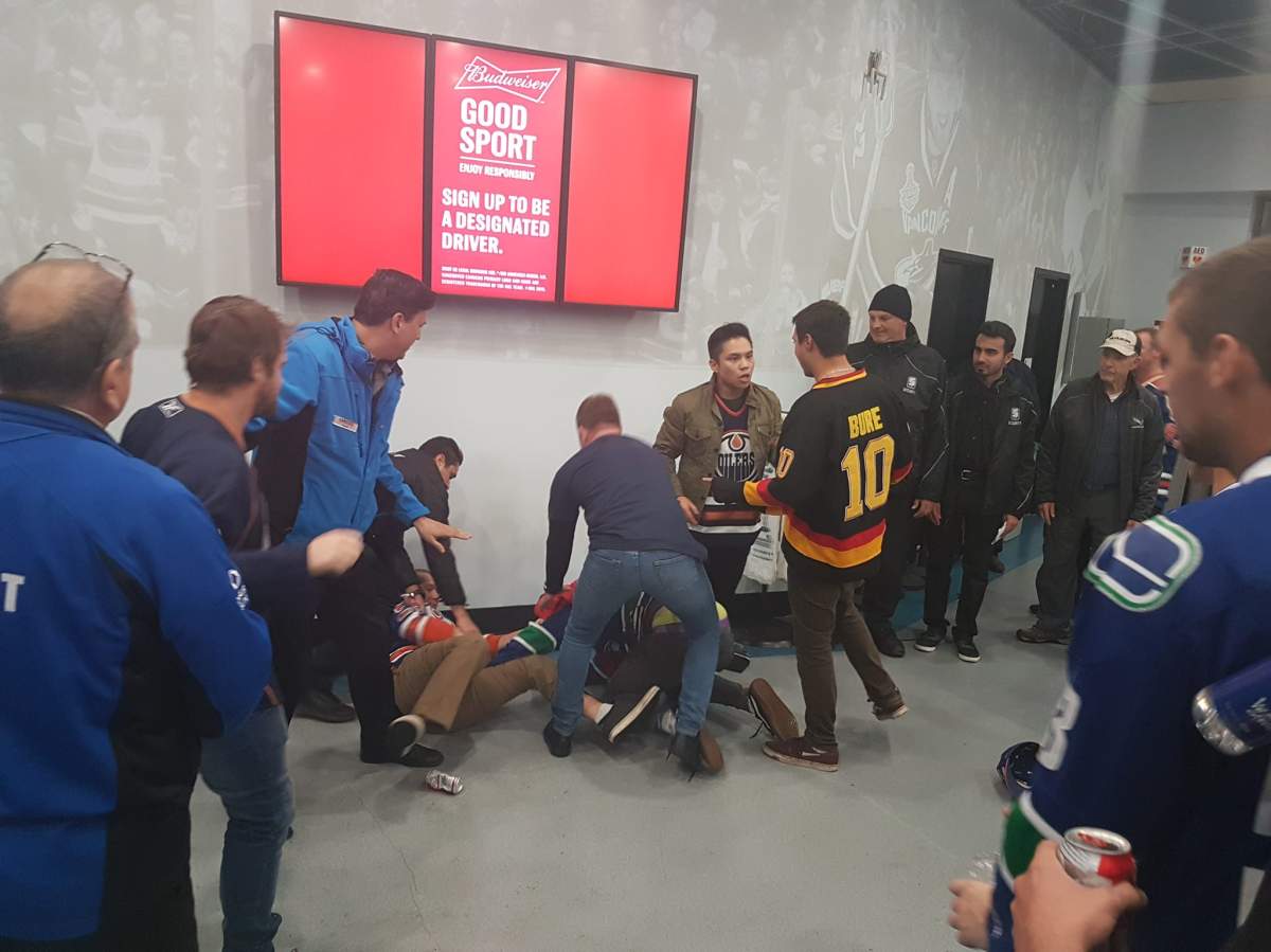 Ryan Pineo said he witnessed a group of Canucks fans attack a group of Oilers fans at Rogers Arena on Saturday night.