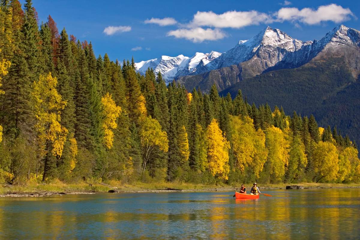 Canoeing down the Cariboo River in Bowron Lake Park.