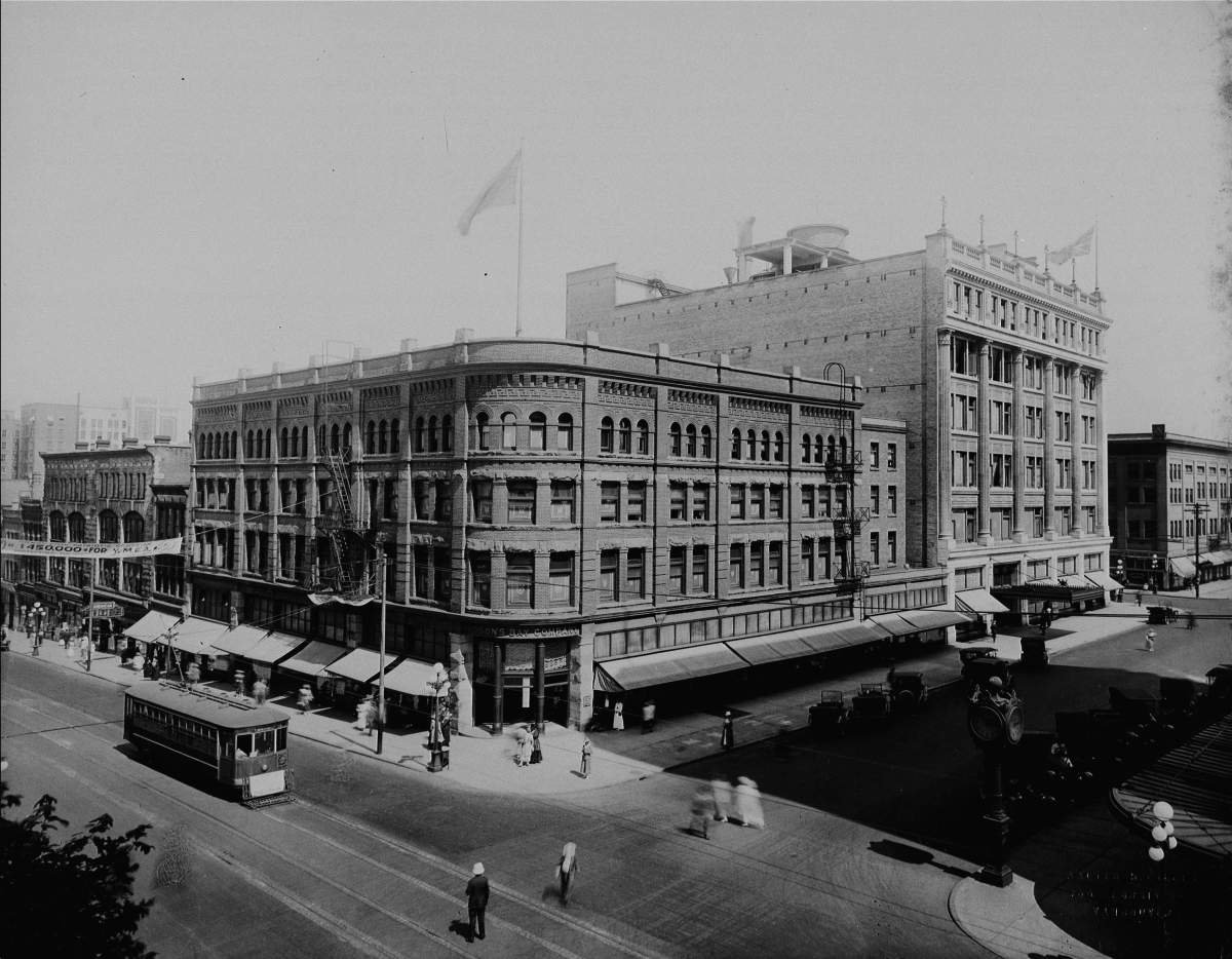 Vancouver, British Columbia on June 10, 1918. Hudson’s Bay Company stores, old store seen in the foreground, new store in the background, with Granville Street on left, Georgia Street on right, in downtown Vancouver.