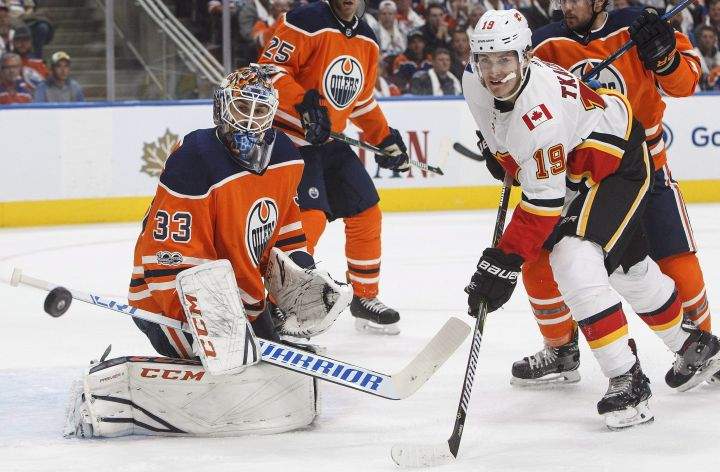 Calgary Flames’ Matthew Tkachuk (19) is stopped by Edmonton Oilers goalie Cam Talbot (33) during first period NHL action in Edmonton, Alta., on Wednesday October 4, 2017.