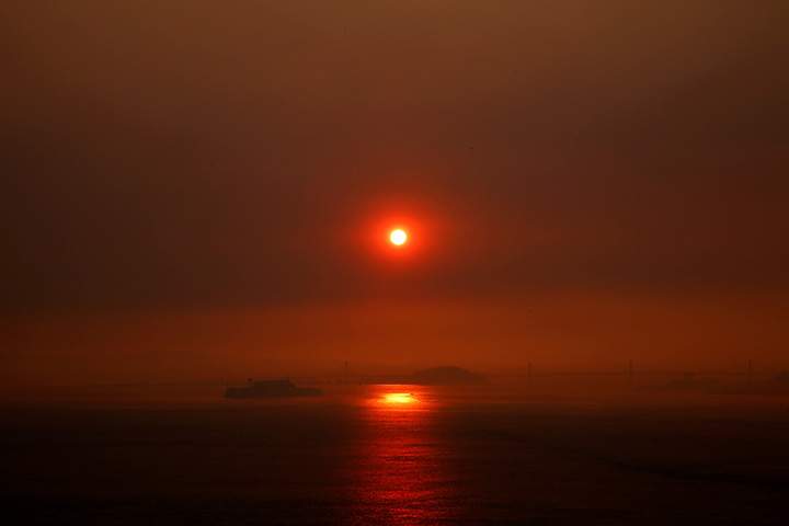 A view of San Francisco as smoke from wildfires in Santa Rosa and Napa Valley covers the sun on October 10, 2017.