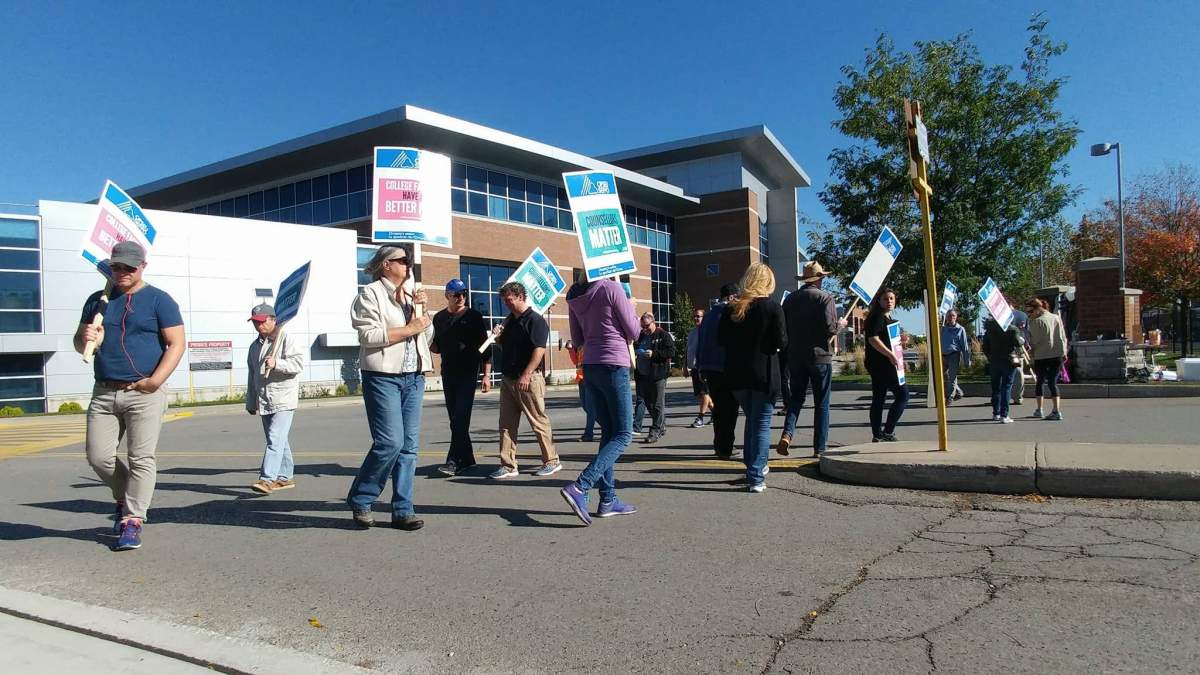 Faculty at Fanshawe College walk the picket line at the entrance in front of T building on Oxford St. E.