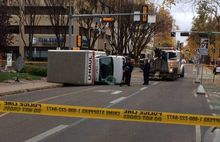 A U-Haul van on its side on 100 Avenue, near 107 Street. October 1, 2017.