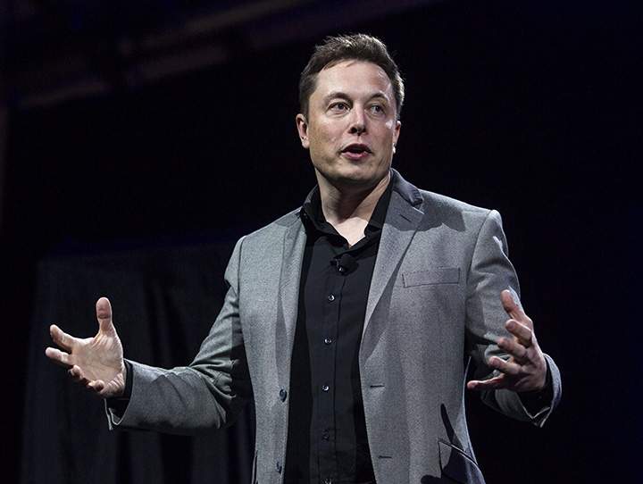 In this April 30, 2015 file photo, Tesla Motors CEO Elon Musk speaks in Hawthorne, Calif. 
