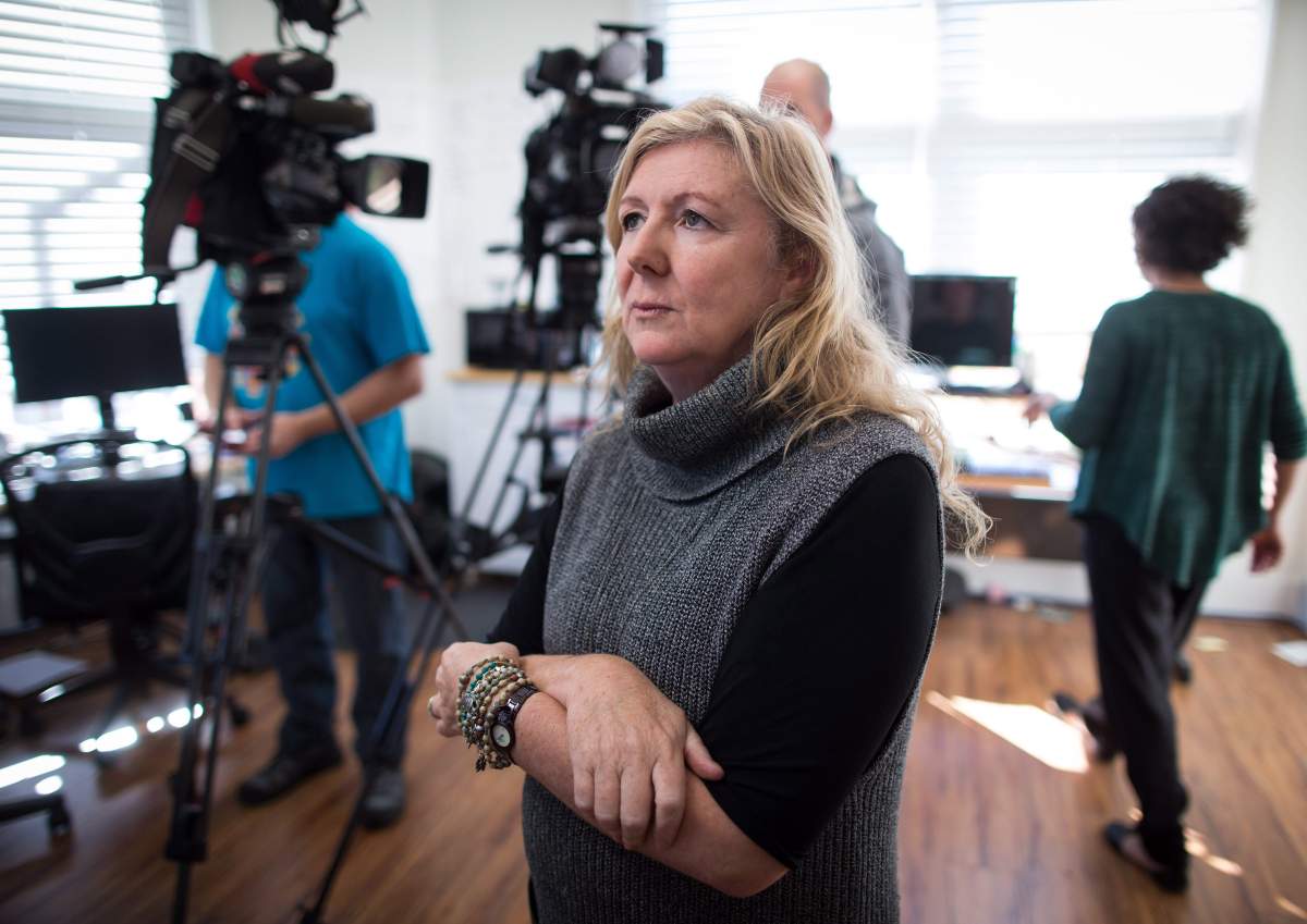 Stand.earth (formerly Forest Ethics) campaign director Karen Mahon speaks to reporters after a bailiff delivered a notice of civil enforcement notifying them of the seizure of assets relating to a $14,559.19 judgement owing to Enbridge from a Line 9 pipeline court challenge, in Vancouver, B.C., on Tuesday, October 17, 2017.