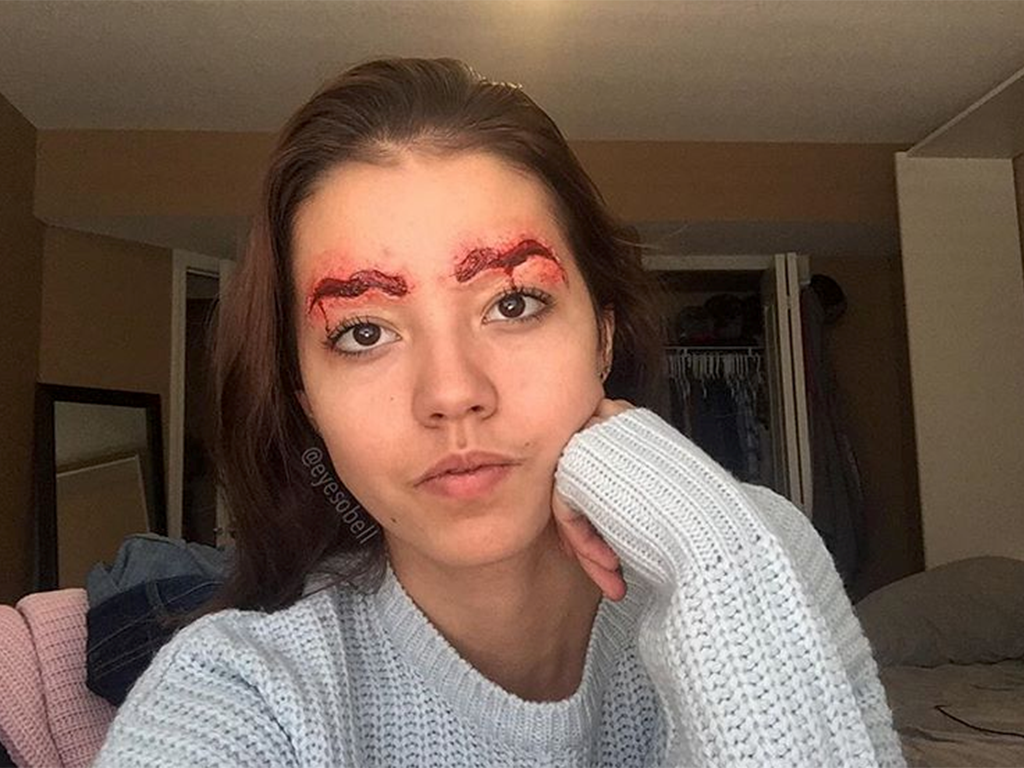 This year has seen a number of new eyebrow trends, but makeup artist Eyesobell's version of bloody squiggle brows may take the cake. 