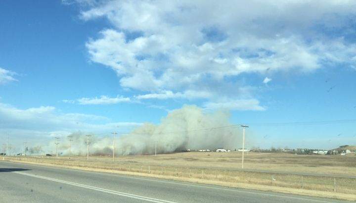 Smoke seen from the east side of Highway 2 as a fire spurred evacuations in Airdrie on Oct. 17, 2017.