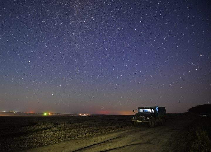 A meteor streaks across the night sky during the Orionid meteor shower in 2016. 