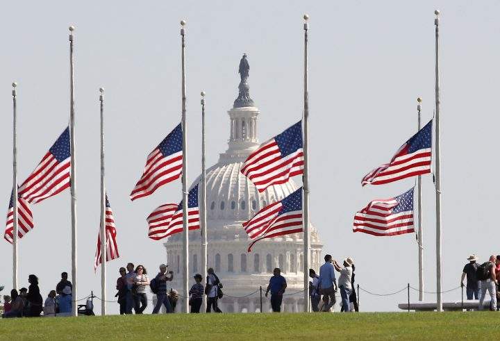 U.S. flags on the grounds of the Washington Monument are lowered to half-staff, on Oct. 2, 2017 in Washington, DC.