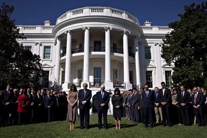 U.S. First Lady Melania Trump, U.S. President Donald Trump, U.S. Vice President Mike Pence, and U.S. Second Lady Karen Pence participate with White House staff in a moment of silence for victims of a Las Vegas mass shooting, on Monday.
