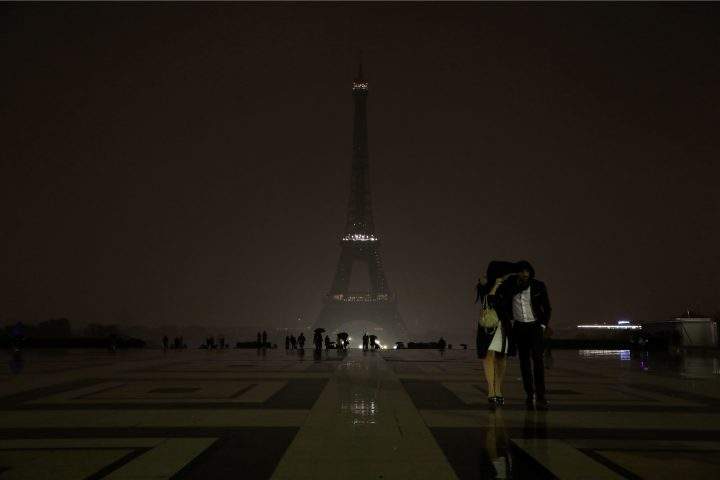 The lights of the Eiffel Tower in Paris are switched off on Oct. 2, 2017 in tribute to the victims of the attacks in Las Vegas and Marseille.